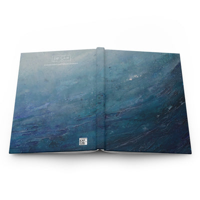 Open notebook with blue marbled design on a white background a great gift for beach lovers