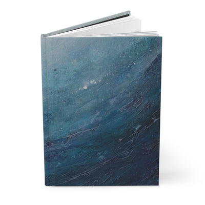 Blue marbled notebook on a white background